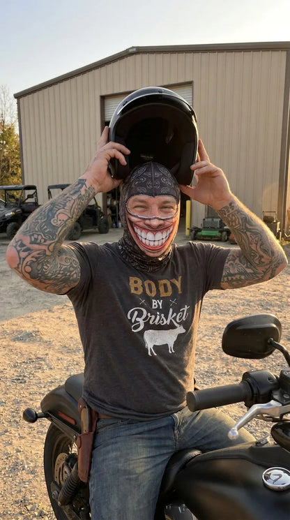 Steve takes off his helmet wearing the Chompy Grug mask